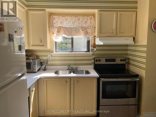 104 - 3740 Don Mills Road, Toronto (Hillcrest Village), ON - Indoor Photo Showing Kitchen With Double Sink