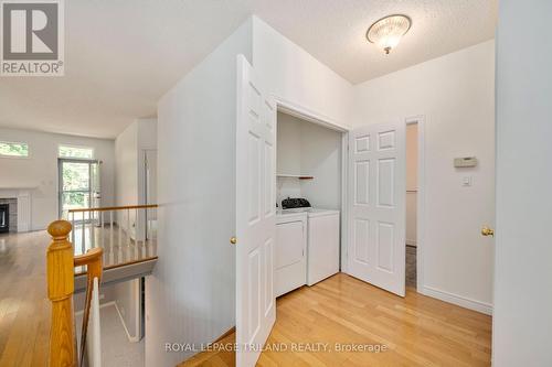 Laundry on Main floor - 60 - 44 Edgevalley Road, London, ON - Indoor Photo Showing Other Room With Fireplace