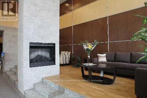 901 - 88 Grangeway Avenue, Toronto (Woburn), ON - Indoor Photo Showing Living Room With Fireplace