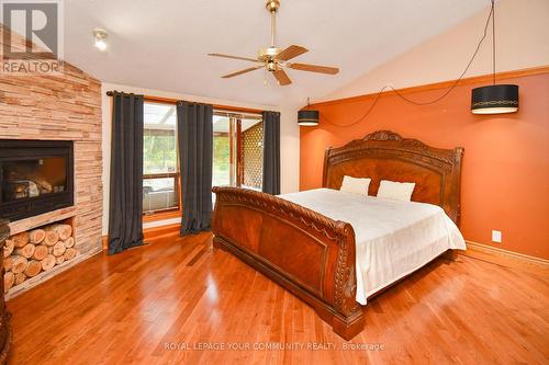 527 Big Bay Point Road, Innisfil, ON - Indoor Photo Showing Bedroom With Fireplace