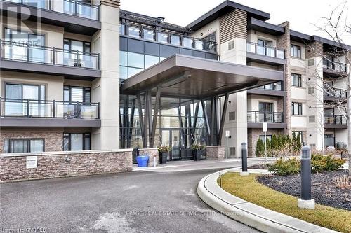 221 - 128 Garden Drive, Oakville, ON - Outdoor With Balcony With Facade