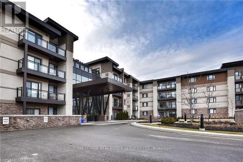 221 - 128 Garden Drive, Oakville, ON - Outdoor With Balcony With Facade