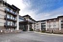 221 - 128 Garden Drive, Oakville, ON  - Outdoor With Balcony With Facade 