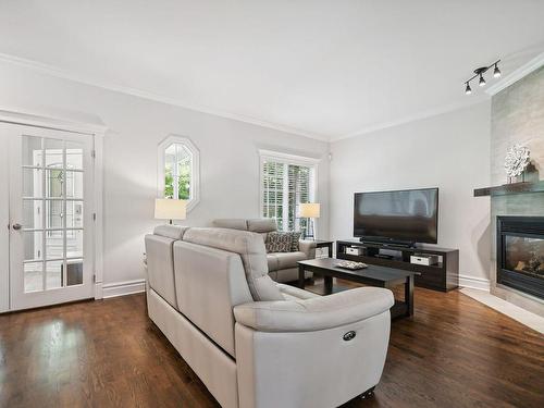 Living room - 16 Rue Du Boisé-Normand, Sainte-Anne-Des-Plaines, QC - Indoor Photo Showing Living Room With Fireplace