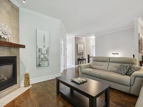 Living room - 16 Rue Du Boisé-Normand, Sainte-Anne-Des-Plaines, QC - Indoor Photo Showing Living Room With Fireplace