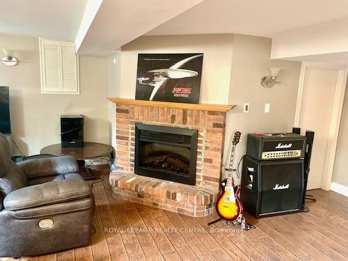 876 West 5Th St, Hamilton, ON - Indoor Photo Showing Living Room With Fireplace