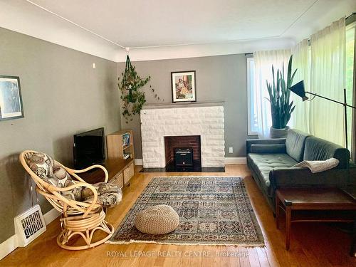 876 West 5Th St, Hamilton, ON - Indoor Photo Showing Living Room With Fireplace