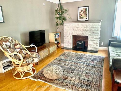 876 West 5Th St, Hamilton, ON - Indoor Photo Showing Living Room With Fireplace