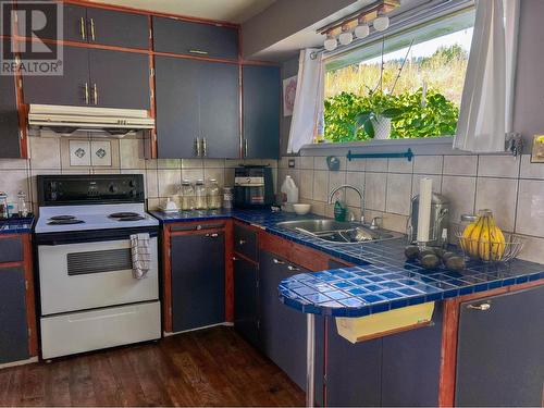 1913  3B Highway, Fruitvale, BC - Indoor Photo Showing Kitchen With Double Sink