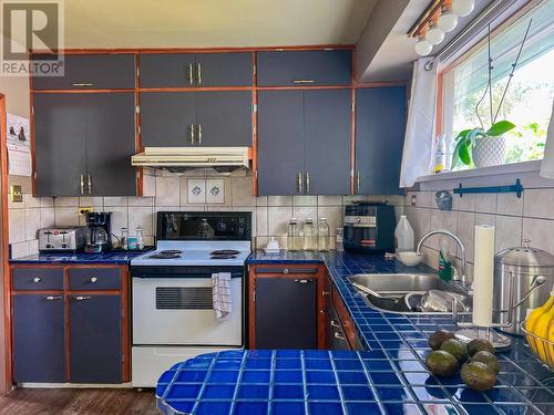 1913  3B Highway, Fruitvale, BC - Indoor Photo Showing Kitchen With Double Sink