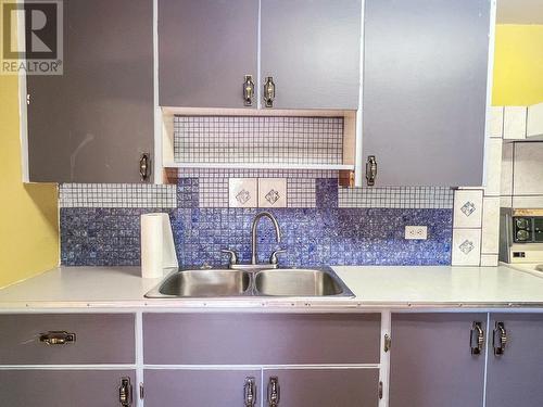 1913  3B Highway, Fruitvale, BC - Indoor Photo Showing Kitchen With Double Sink