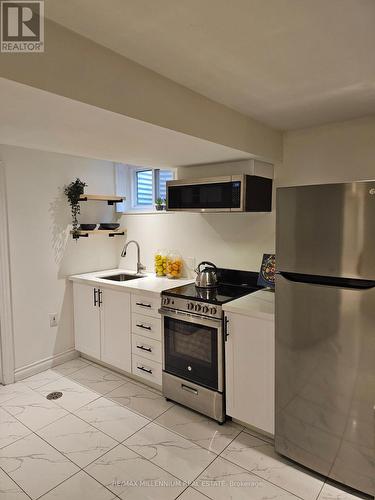 65 Vange Crescent, Toronto (Mount Olive-Silverstone-Jamestown), ON - Indoor Photo Showing Laundry Room