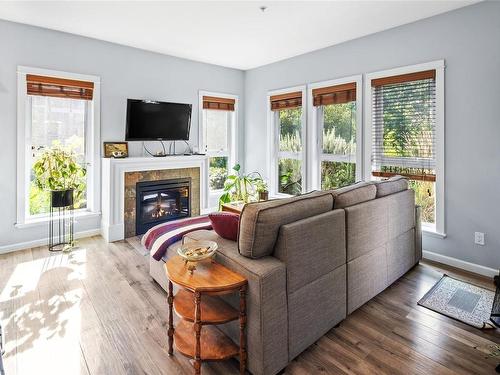 107-201 Nursery Hill Dr, View Royal, BC - Indoor Photo Showing Living Room With Fireplace