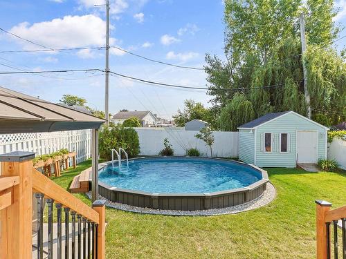 Backyard - 220 Rue Berger, Saint-Constant, QC - Outdoor With Above Ground Pool With Backyard