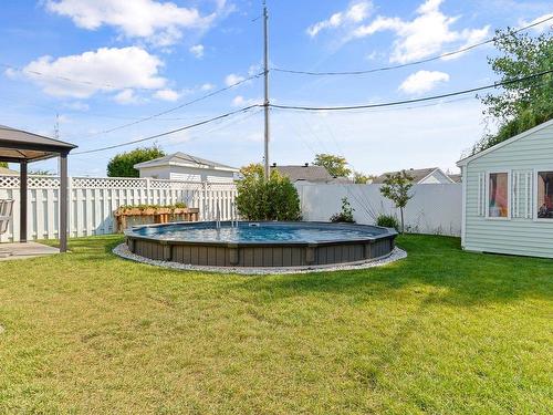 Backyard - 220 Rue Berger, Saint-Constant, QC - Outdoor With Above Ground Pool