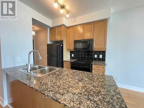 911 - 80 Absolute Avenue N, Mississauga, ON - Indoor Photo Showing Kitchen With Double Sink