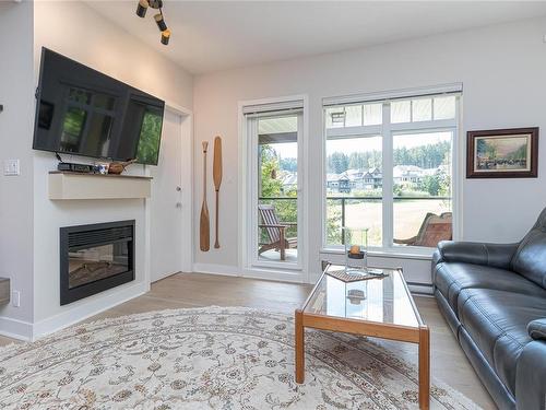 216-1375 Bear Mountain Pkwy, Langford, BC - Indoor Photo Showing Living Room With Fireplace