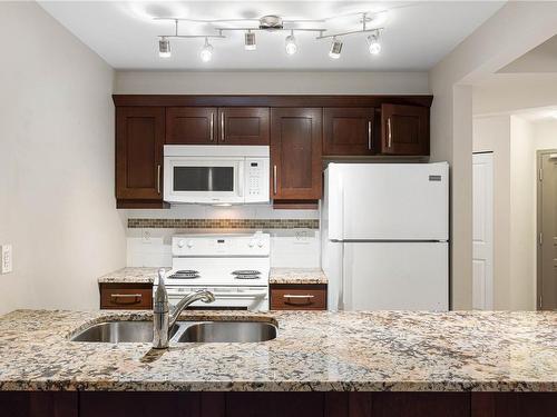 202-5670 Edgewater Lane, Nanaimo, BC - Indoor Photo Showing Kitchen With Double Sink