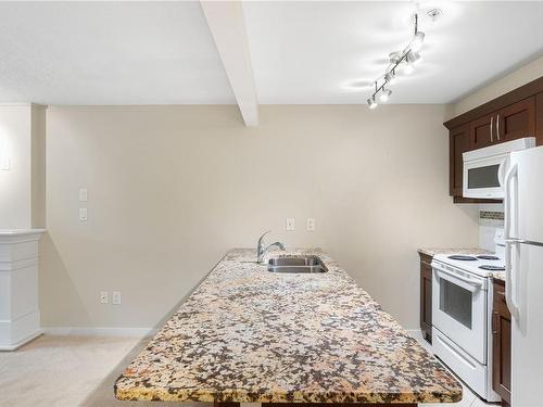 202-5670 Edgewater Lane, Nanaimo, BC - Indoor Photo Showing Kitchen With Double Sink