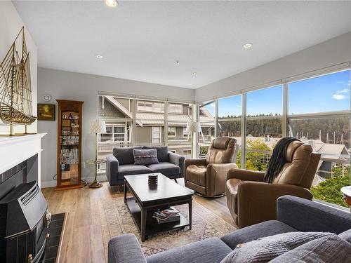 606-500 Stewart Ave, Nanaimo, BC - Indoor Photo Showing Living Room With Fireplace