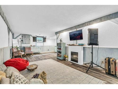 18 Spruyt Ave, East Luther Grand Valley, ON - Indoor Photo Showing Living Room With Fireplace