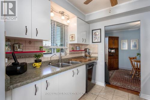 708 - 358 Waterloo Avenue S, Guelph (Central West), ON - Indoor Photo Showing Kitchen With Double Sink