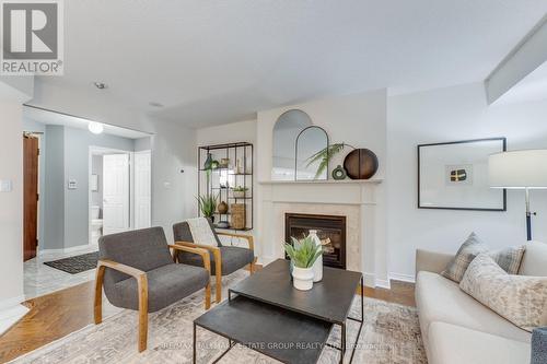 202 - 38 Avoca Avenue, Toronto, ON - Indoor Photo Showing Living Room With Fireplace