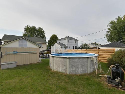 Cour - 48 Rue Lefebvre, Saint-Constant, QC - Outdoor With Above Ground Pool With Backyard