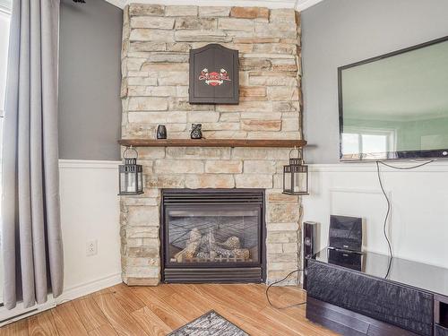 Living room - 302-476 Ch. De La Grande-Côte, Saint-Eustache, QC - Indoor Photo Showing Living Room With Fireplace