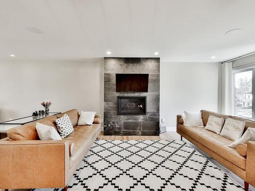 Living room - 17035 Rue Du Corail, Mirabel, QC - Indoor Photo Showing Living Room With Fireplace