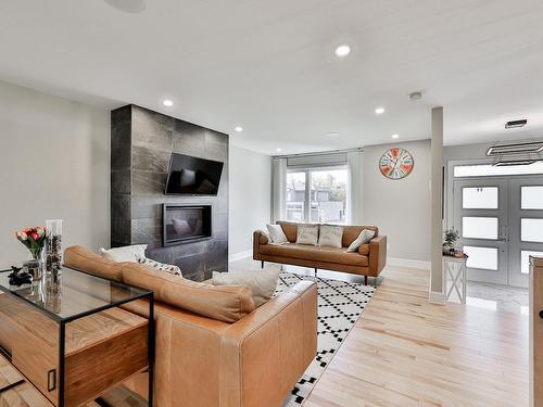 Living room - 17035 Rue Du Corail, Mirabel, QC - Indoor Photo Showing Living Room With Fireplace