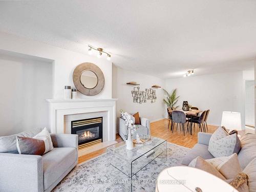 301-2371 Queen St E, Toronto, ON - Indoor Photo Showing Living Room With Fireplace