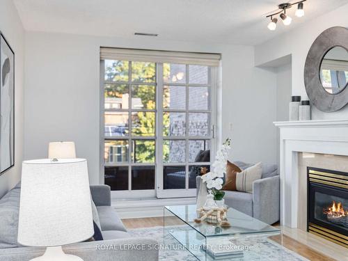 301-2371 Queen St E, Toronto, ON - Indoor Photo Showing Living Room With Fireplace