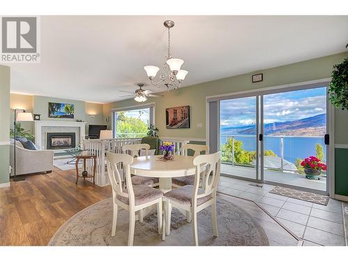 6050 Beatrice Road, Peachland, BC - Indoor Photo Showing Dining Room With Fireplace