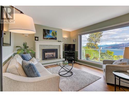 6050 Beatrice Road, Peachland, BC - Indoor Photo Showing Living Room With Fireplace