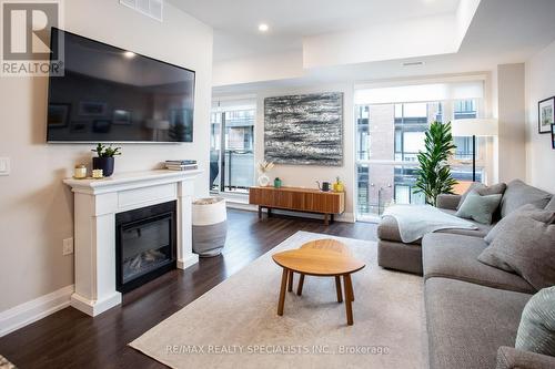 E403 - 52 Coles Avenue, Vaughan, ON - Indoor Photo Showing Living Room With Fireplace