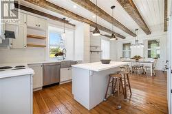 Kitchen with island in stone home - 