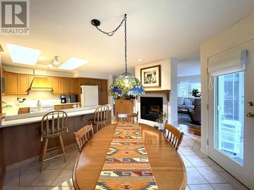 1220 Mill  Street Unit# 1, Nelson, BC - Indoor Photo Showing Dining Room With Fireplace