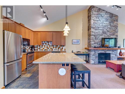 47 Rivermount Place Unit# 101A, Fernie, BC - Indoor Photo Showing Kitchen With Fireplace