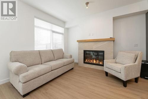 703 15A  Crescent Unit# 15, Invermere, BC - Indoor Photo Showing Living Room With Fireplace