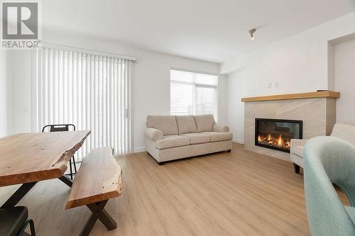 703 15A  Crescent Unit# 15, Invermere, BC - Indoor Photo Showing Living Room With Fireplace