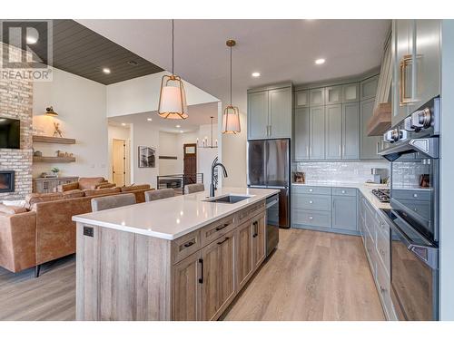 1668 Marcer Road, Jaffray, BC - Indoor Photo Showing Kitchen With Fireplace With Upgraded Kitchen