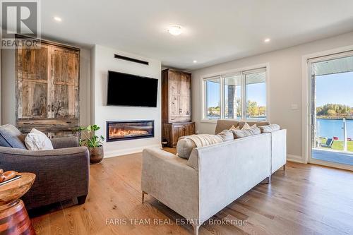 7 Dock Lane, Tay, ON - Indoor Photo Showing Living Room With Fireplace