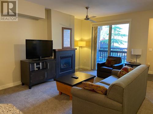 2049 Summit  Drive Unit# 214D, Panorama, BC - Indoor Photo Showing Living Room With Fireplace