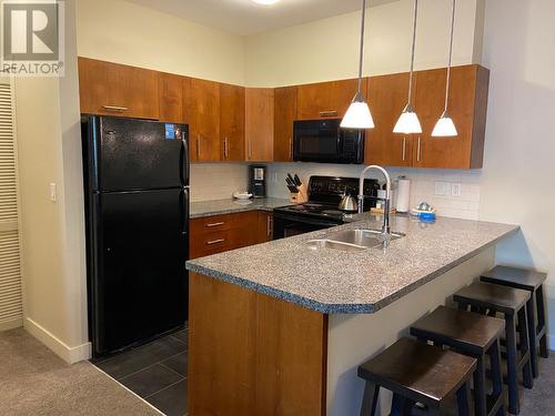 2049 Summit  Drive Unit# 214D, Panorama, BC - Indoor Photo Showing Kitchen With Double Sink