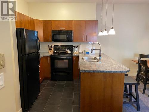 2049 Summit  Drive Unit# 214D, Panorama, BC - Indoor Photo Showing Kitchen With Double Sink