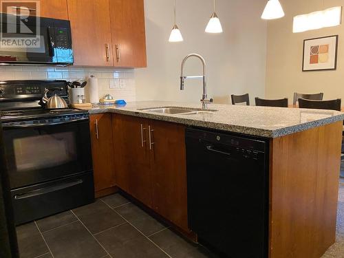 2049 Summit  Drive Unit# 214D, Panorama, BC - Indoor Photo Showing Kitchen With Double Sink