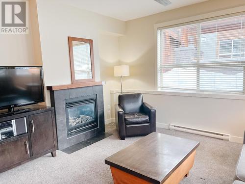 2049 Summit Drive Unit# 115D, Panorama, BC - Indoor Photo Showing Living Room With Fireplace