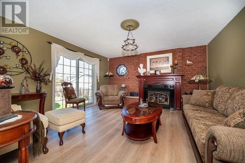 1315 Blakely Crescent, Pembroke, ON - Indoor Photo Showing Living Room With Fireplace