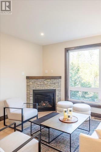 4576 Timberline Crescent Unit# 39, Fernie, BC - Indoor Photo Showing Living Room With Fireplace